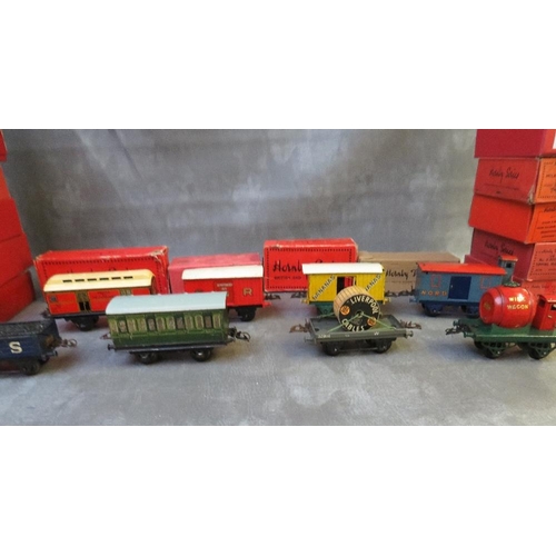 132 - LARGE BOX CONTAINING TWENTY HORNBY O GAUGE BOXED ROLLING STOCK, to include luggage van, gunpowder va... 