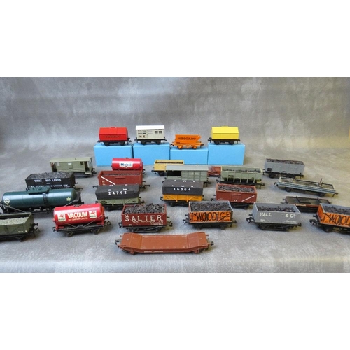 FOUR BOXED OO GAUGE HORNBY DUBLO PIECES OF ROLLING STOCK, Rotary tipper, cement wagon, cattle truck, Portland cement together with twenty two unboxed pieces of rolling stock