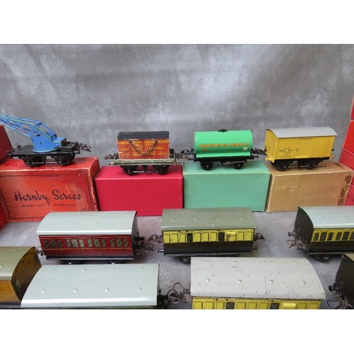 141 - ELEVEN BOXED O GAUGE ROLLING STOCK, to include crane truck, flat truck milk traffic wagon, side tipp... 