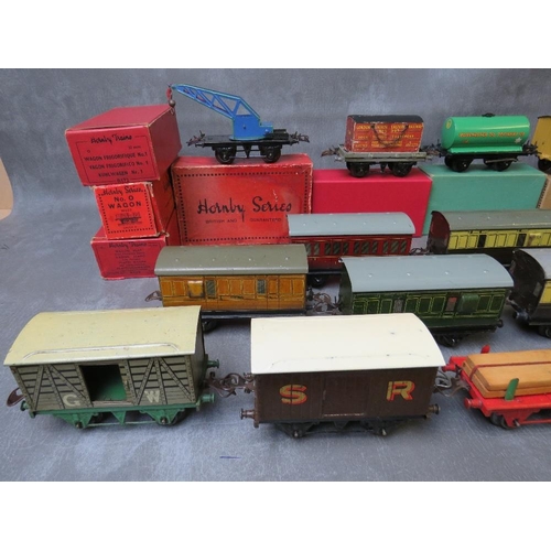 141 - ELEVEN BOXED O GAUGE ROLLING STOCK, to include crane truck, flat truck milk traffic wagon, side tipp... 