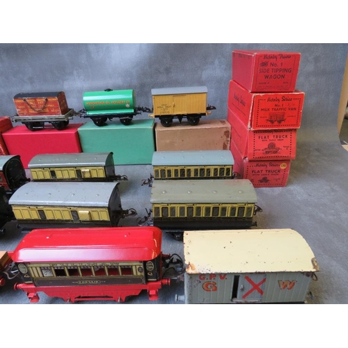 141 - ELEVEN BOXED O GAUGE ROLLING STOCK, to include crane truck, flat truck milk traffic wagon, side tipp... 