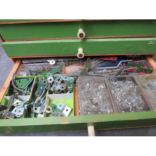 142 - WOODEN FOUR DRAWER CHEST FULL OF MECCANO