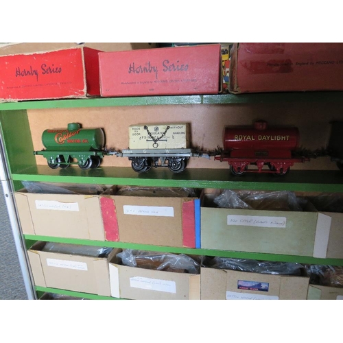 161 - A WOODEN CABINET CONTAINING TWENTY PIECES OF O GAUGE ROLLING STOCK, to include tankers, cattle wagon... 