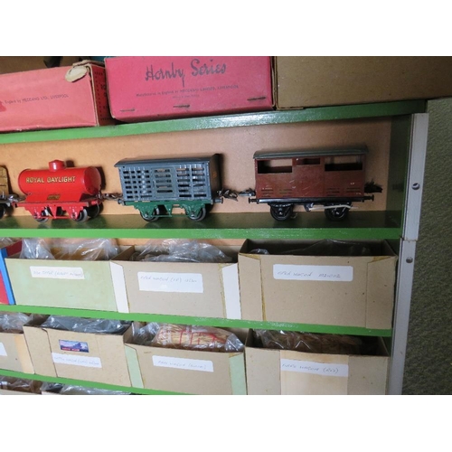 161 - A WOODEN CABINET CONTAINING TWENTY PIECES OF O GAUGE ROLLING STOCK, to include tankers, cattle wagon... 