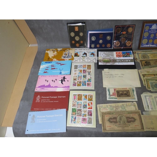 41 - A COLLECTION OF COINS, BANK NOTES AND STAMPS, to include proof sets 1971, 1980, 1982, 1993, 1194 etc