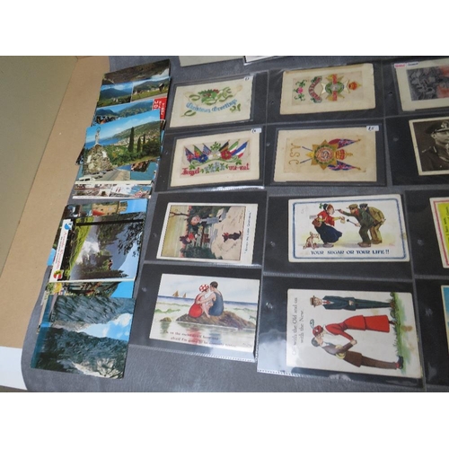 48 - A COLLECTION OF POSTCARDS, to include two albums and loose cards, inlcuding vintage silks, saucy sea... 