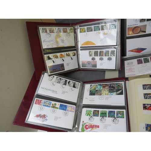 53 - SIX FIRST DAY COVER ALBUMS, together with four British stamp albums, one of which contains many Vict... 