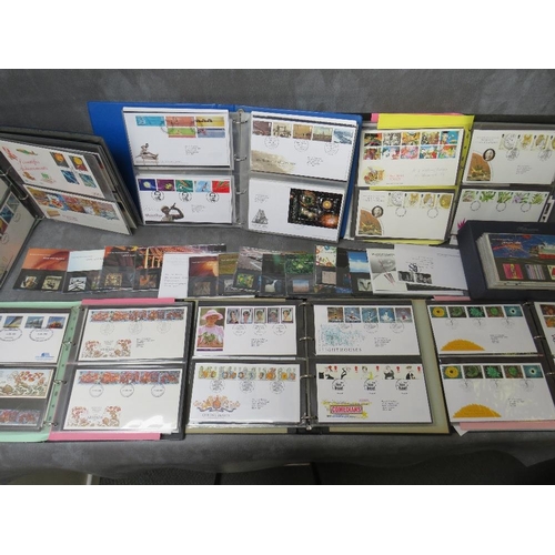 74 - SIX ALBUMS OF FIRST DAY COVERS, mainly 1980s / 1990s, together with a Royal Mail Millenium collectio... 