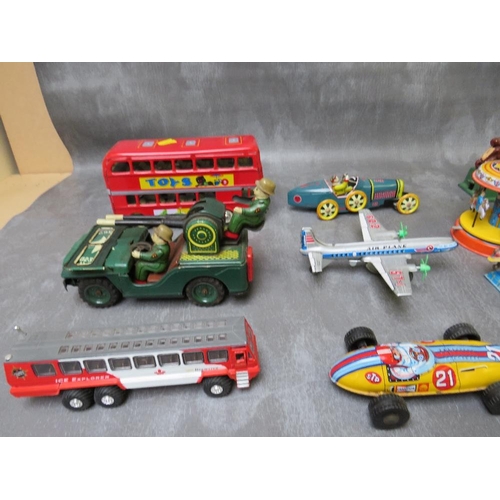 84 - A TRAY OF MAINLY TIN PLATE TOYS, to include an early American military vehicle, bus, plane, rocket r... 