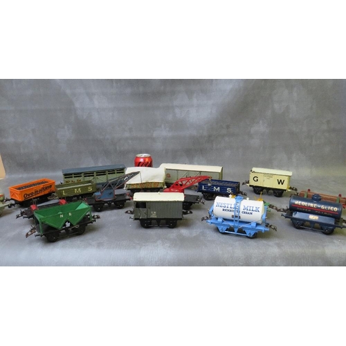 91 - SEVENTEEN UNBOXED PIECES OF O GAUGE ROLLING STOCK, mainly Hornby, to include cranes, tankers, covere... 