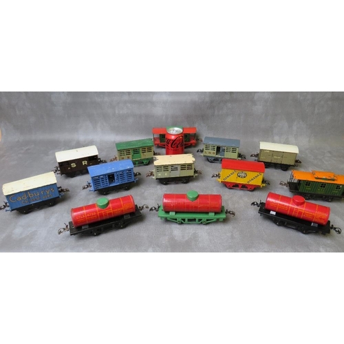 94 - THIRTEEN UNBOXED PIECES OF O GAUGE ROLLING STOCK, comprising three tankers and ten covered wagons