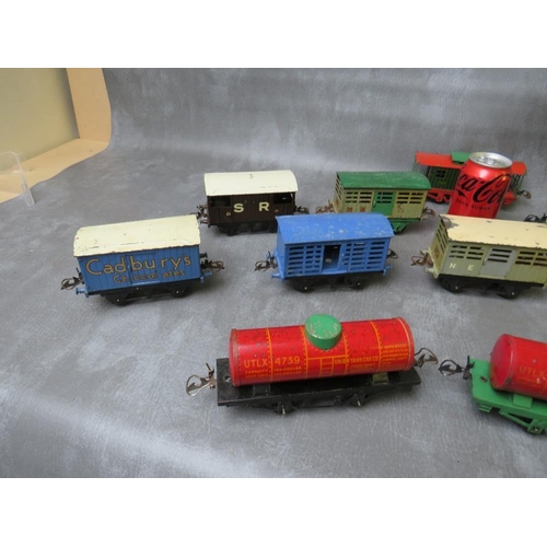 94 - THIRTEEN UNBOXED PIECES OF O GAUGE ROLLING STOCK, comprising three tankers and ten covered wagons