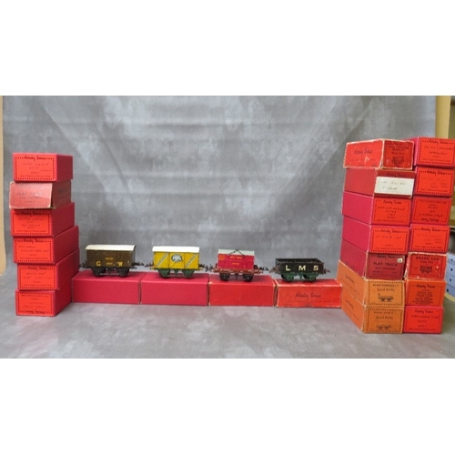 171 - TWENTY FOUR BOXED HORNBY O GAUGE ROLLING STOCK, to include tank wagon, brake van, low sided wagon PO... 