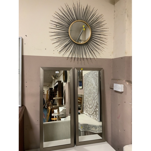 805 - A modern circular sun burst style mirror together with two modern rectangular mirrors. (3)