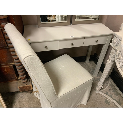 806 - A modern three drawer side table together with an upholstered chair