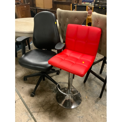 815 - A modern red swivel barstool together with an office armchair