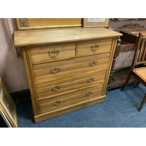 831 - An Edwardian stripped five drawer chest of drawers W 107 cm