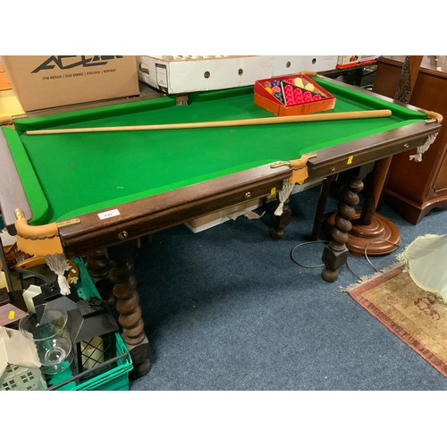 841 - A small slate bed snooker table on a barleytwist separate base, with a cue and accessories 72 x 133 ... 