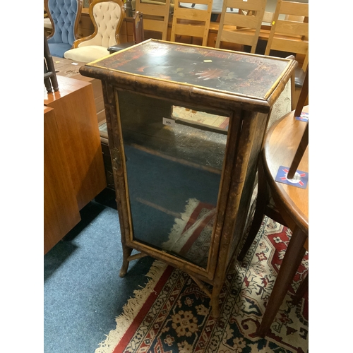 866 - A bamboo and lacquered glazed single door cabinet together with two Eastern occasional tables