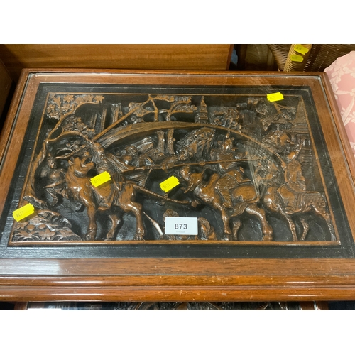 873 - An Eastern nest of four carved tables with glass tops