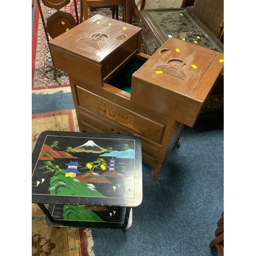 874 - An Eastern style sewing box on castors together with a small lacquered table. (2)