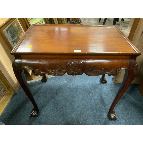 882 - An antique mahogany small silver table in the Irish style, raised on cabriole supports with ball and... 