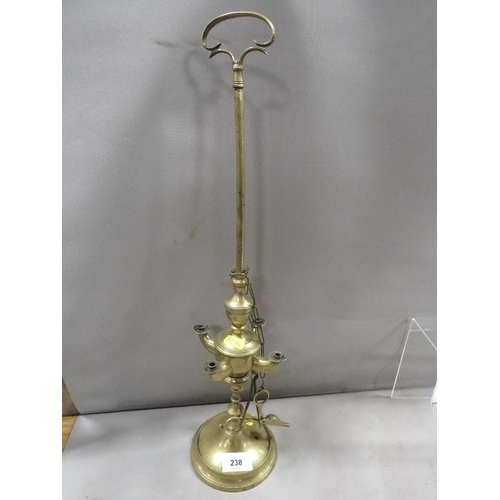 467 - An antique brass Lucerne standing lamp