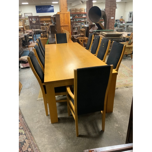 885 - A huge oak kitchen/boardroom table with ten upholstered armchairs H 79 cm W 113 cm L 292 cm