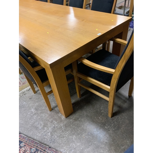 885 - A huge oak kitchen/boardroom table with ten upholstered armchairs H 79 cm W 113 cm L 292 cm