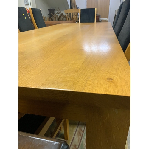 885 - A huge oak kitchen/boardroom table with ten upholstered armchairs H 79 cm W 113 cm L 292 cm