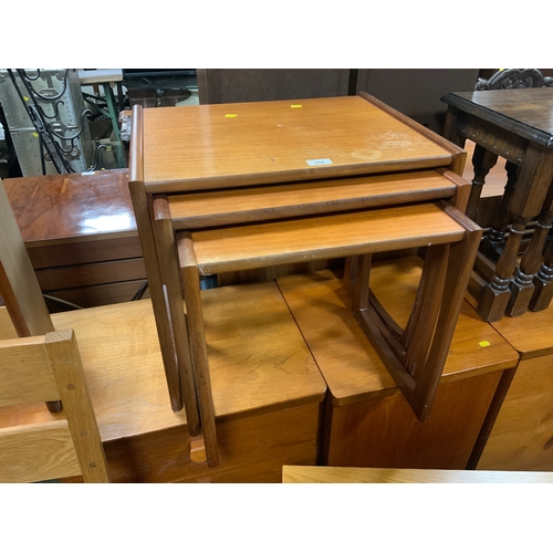 894 - A mid century G-Plan nest of three teak tables S/D