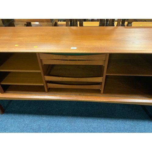 907 - A mid century teak sideboard with sliding tambour doors W 211 cm