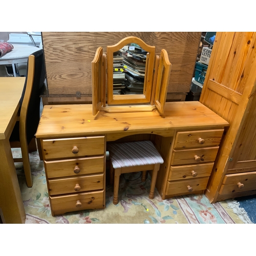 911 - A honey pine dressing table with triple mirror and stool