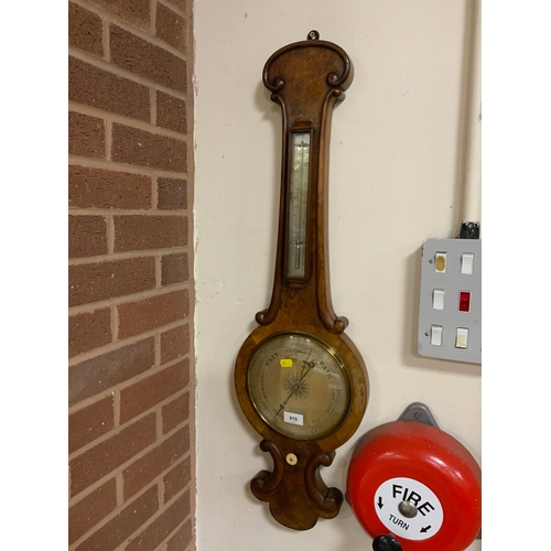 919 - An antique walnut barometer