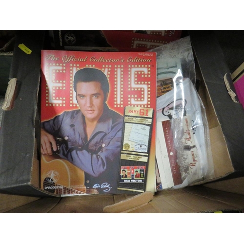 343 - Four trays of mostly Elvis Presley collectables DVD's etc