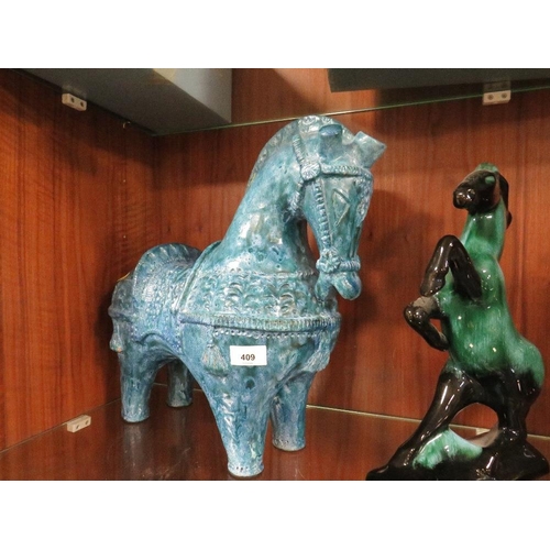 409 - An unusual blue ceramic horse together with another (2)