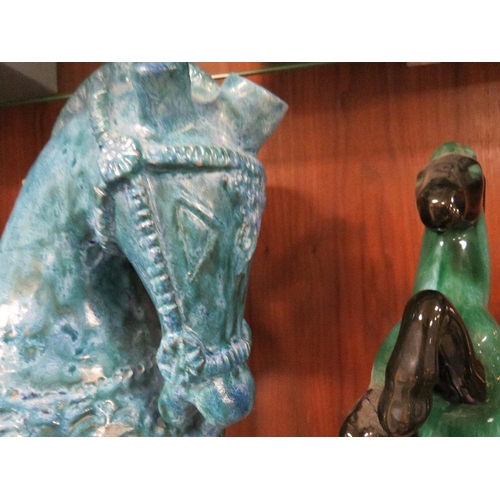 409 - An unusual blue ceramic horse together with another (2)