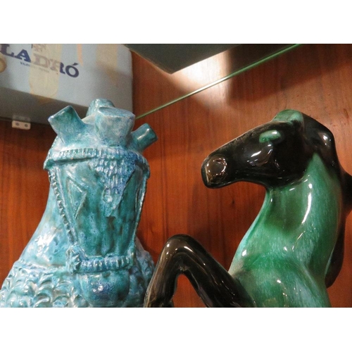 409 - An unusual blue ceramic horse together with another (2)