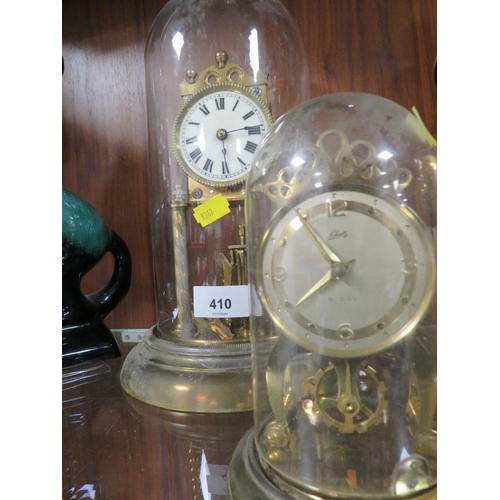 410 - A glass dome clock together with a plastic dome clock (2)