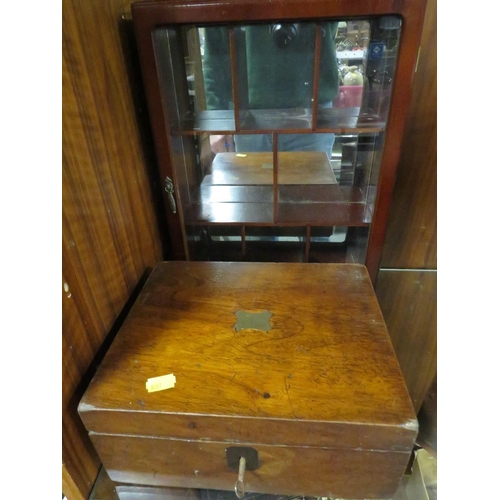 412 - A vintage three section tea caddy together with a small writing slope and a small glazed display cab... 