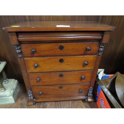 429 - A miniature apprentice style mahogany chest of drawers