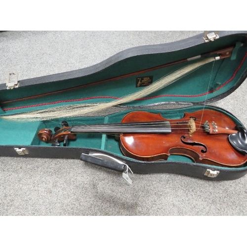 450 - A vintage leather covered wooden cased violin with bow