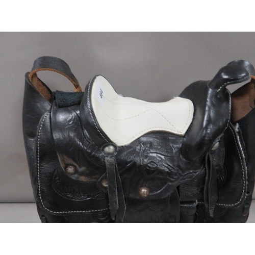 464 - An unusual black and white Mexican made leather horse saddle handbag