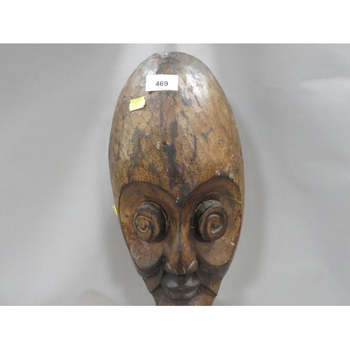 469 - A carved wooden ethnic head