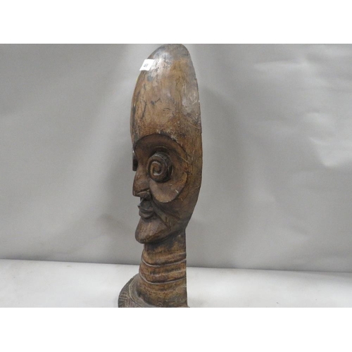 469 - A carved wooden ethnic head