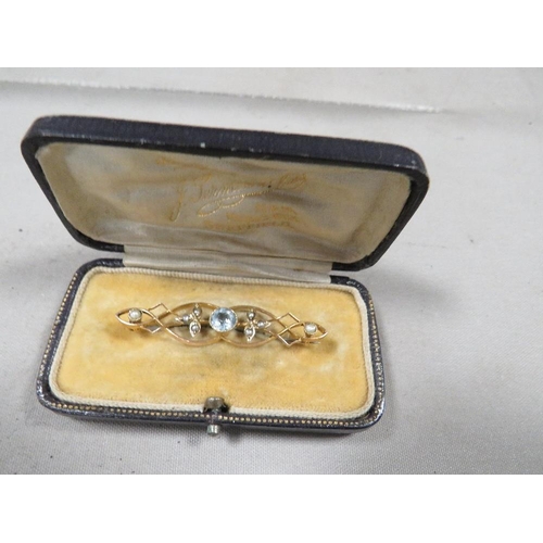 A Victorian Aquamarine and seed pearl brooch marked 9ct in original box