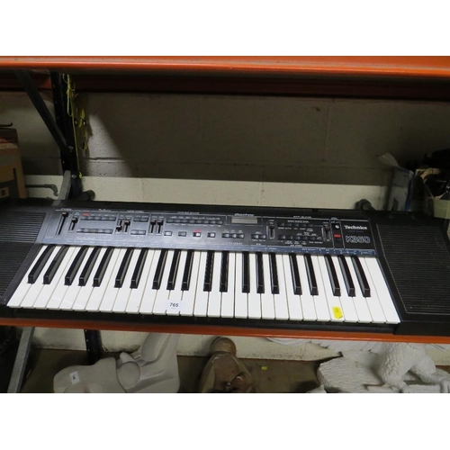 765 - A Technics K350 keyboard, stand and charger