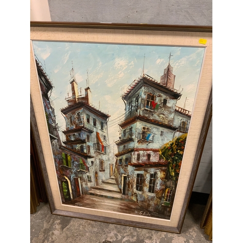 223 - A large signed Portuguese style oil on canvas depicting a narrow town scene 90 x 61 cm