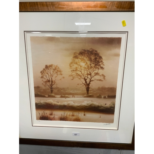 227 - A framed limited edition print of a wintery landscape signed but indistinct 47 x 44 cm