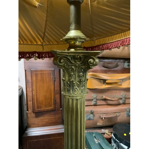 726 - A vintage heavy brass Corinthian column standard lamp with shade